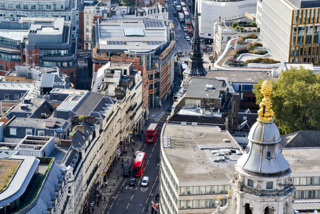 View of London street by St. Paul's Cathedral with iconic red bus
