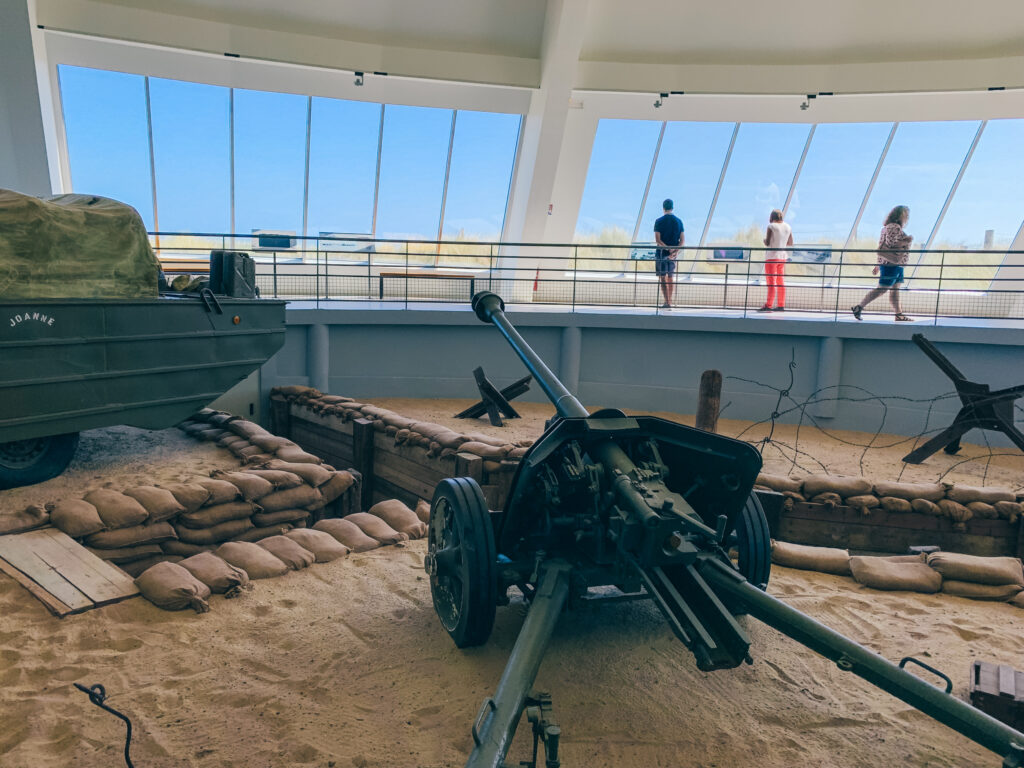 View out to the English Channel from inside the Utah Beach Museum with military vehicles on display