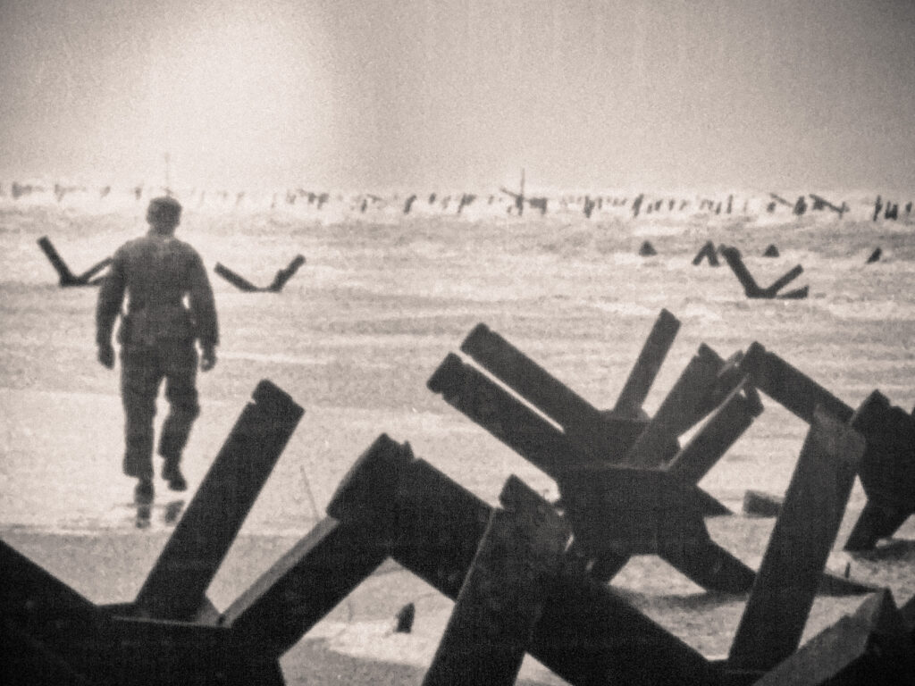 Black and white photo of War scene at Overlord Museum at Omaha Beach Normandy